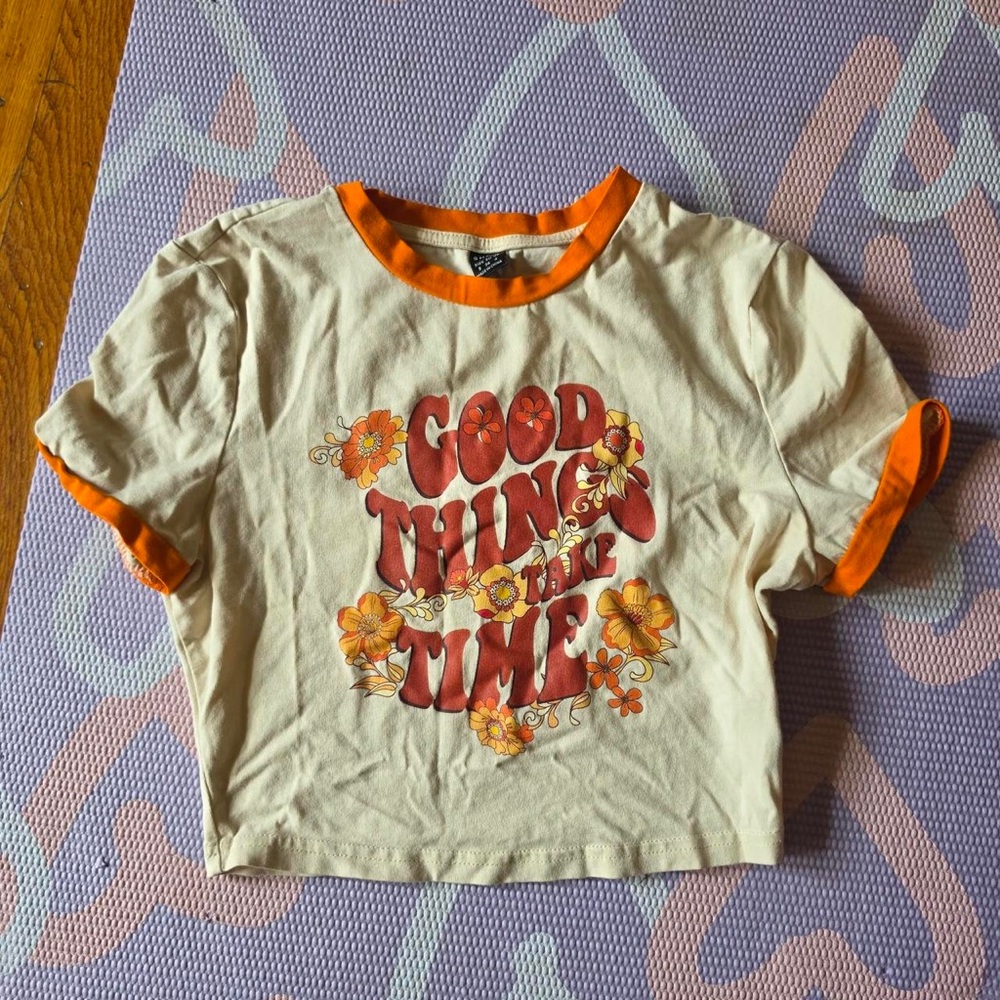 SHEIN Cream Crop Tee with Orange Trim and Floral Graphic